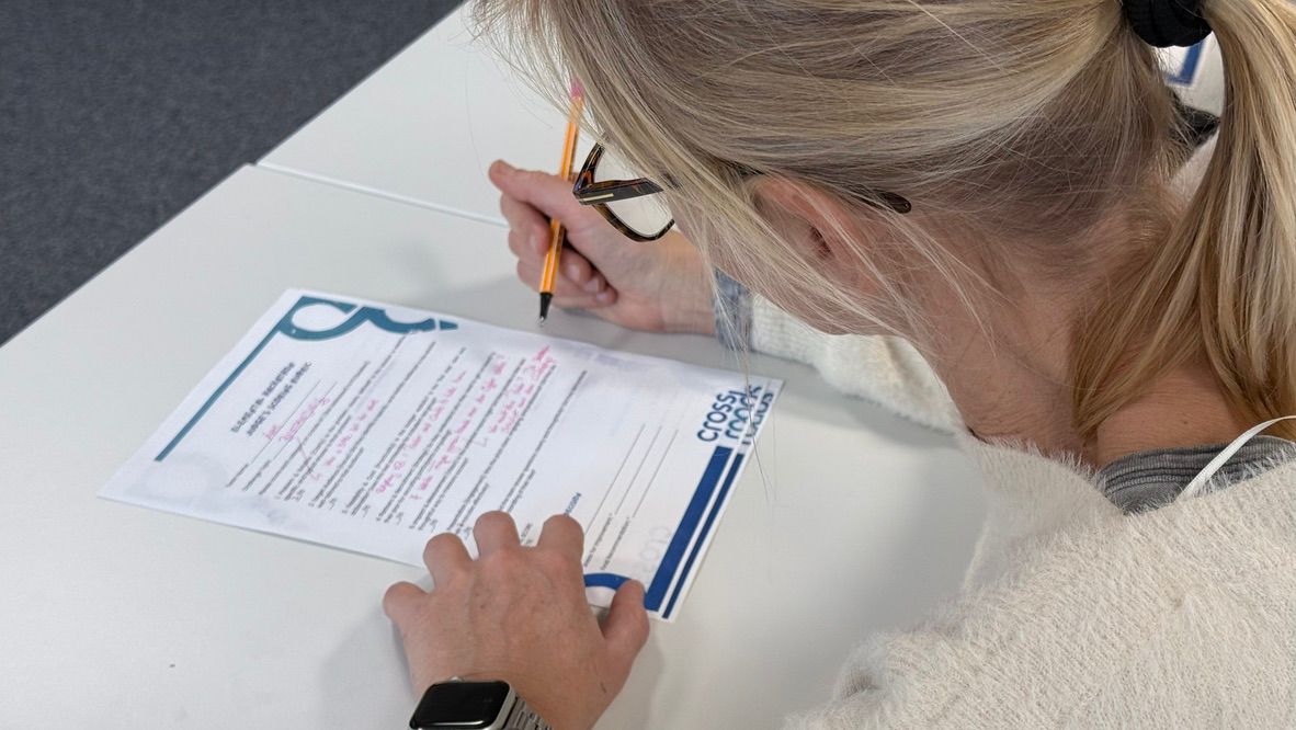 Student filling out a Crossroads workshop form